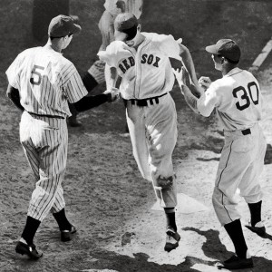 Ted Williams is greeted by Yankees legend Joe DiMaggio as he crosses home plate after his game-winning home run in the 1941 All-Star Game at Briggs Stadium.