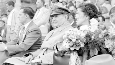 General Douglas MacArthur seated with his wife while visiting Detroit on May 15, 1952. That same day, Virgil Trucks tossed a no-hitter for the Detroit Tigers at Briggs Stadium.