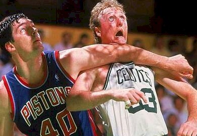Bill Laimbeer does what he has to do to box out Larry Bird of the Boston Celtics.