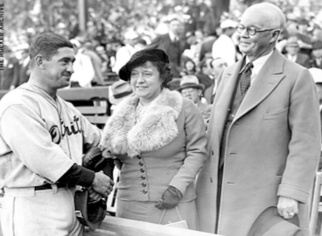 Tigers player/manager Mickey Cochrane greets Mr and Mrs Frank Navin prior to a game in Detroit during the 1935 World Series.