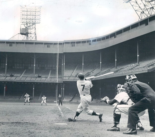Mickey Mantle launches a towering home run at Briggs Stadium in Detroit in 1958.